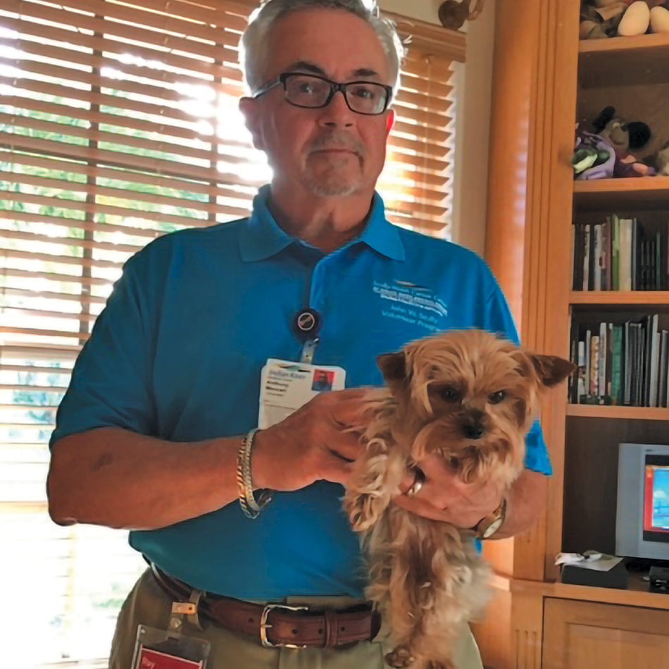 Ray Mancari holding a dog