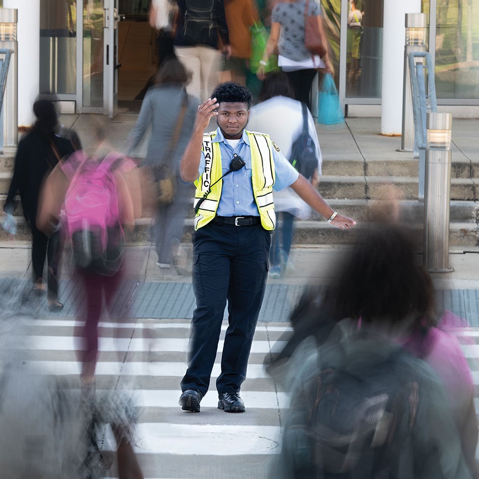 Bryson Wimbley directing pedestrian traffic