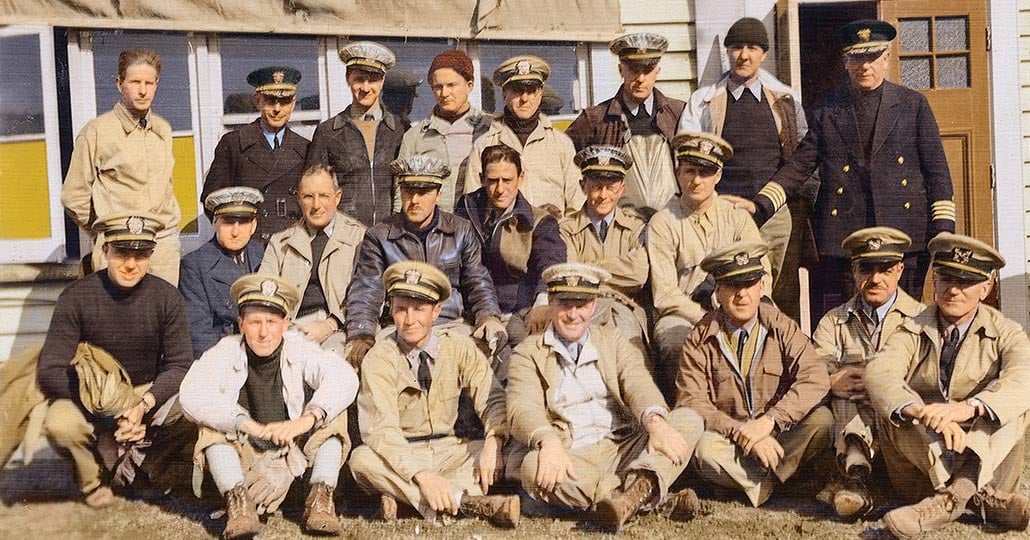 Image of the naval reserve unit, all wearing khaki uniforms and hats