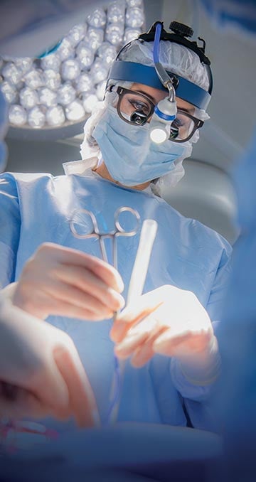 Female doctor, during surgery