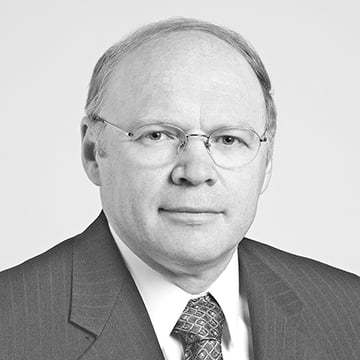 Lars Svensson headshot. He is wearing a suit and tie