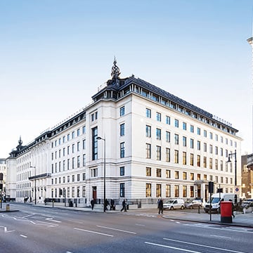 Outdoor photo of a white 5-story building in London.