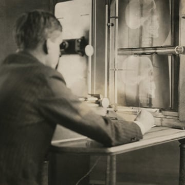 Man looks at an X-ray image