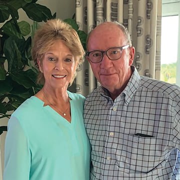 Charles (right) and Christine (left) Carroll posing for a photo together