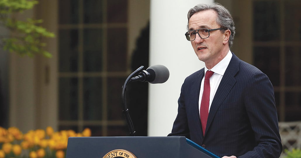 Dr. Mihaljevic standing at a presidential podium talking.