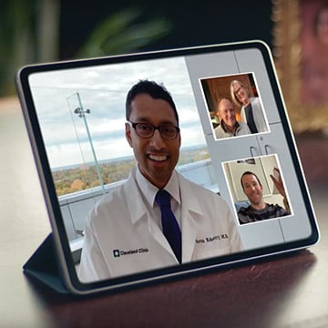 Doctor having a video call with patients and family