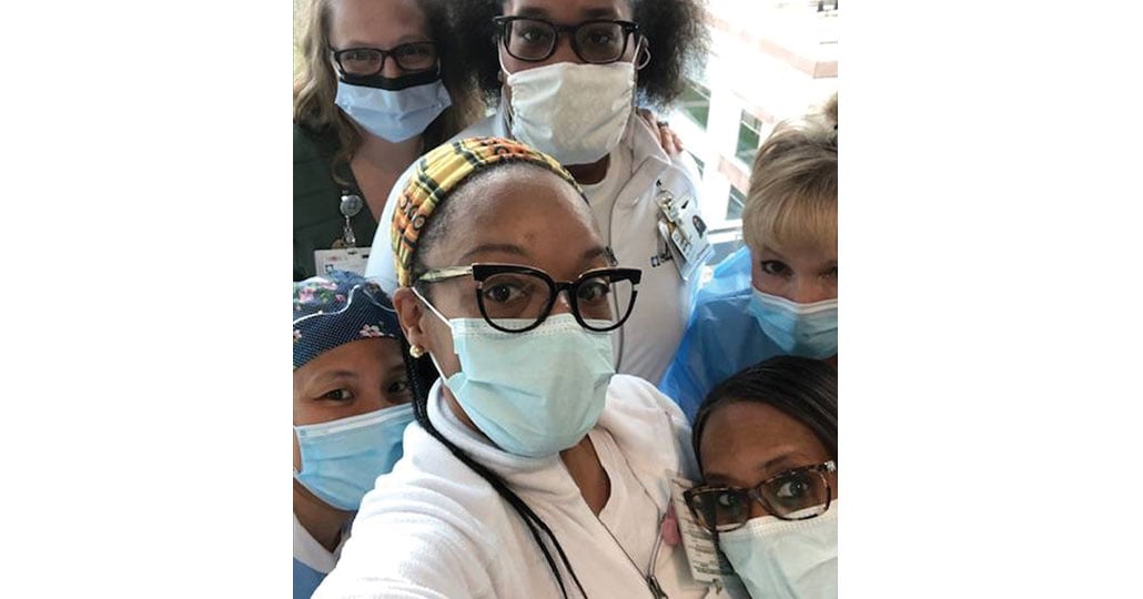 a picture of 6 nurses is PPE gear