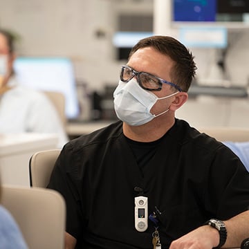 man wearing protective eye gear and a facemask