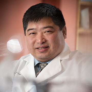 Dr. Timothy Chan smiling at the camera